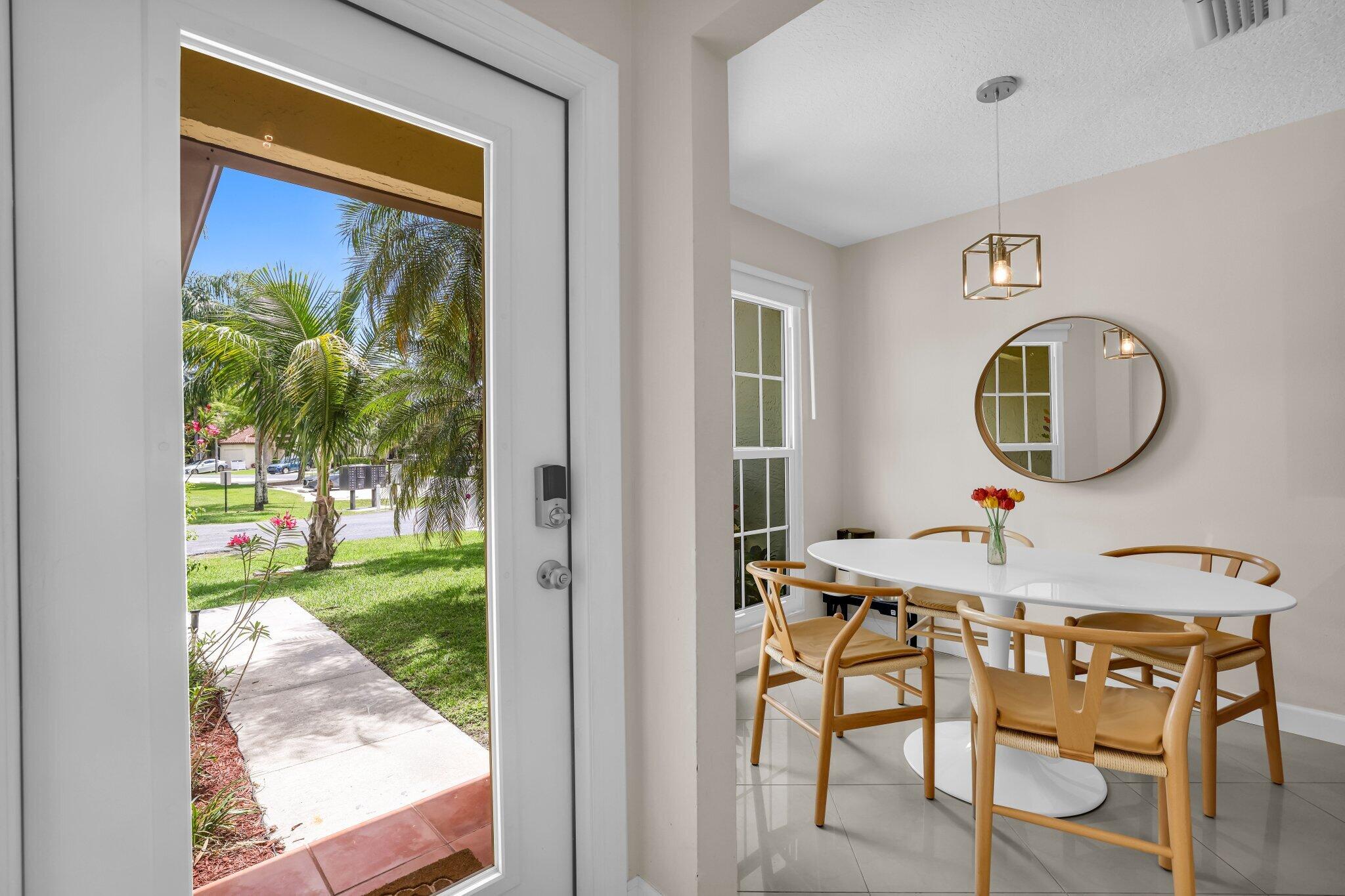 10323 Hidden Springs Court Boca Raton, FL 33498 - Photo 5 of 41 a view of a living room and a backyard
