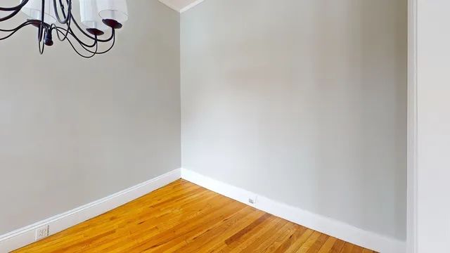 a view of a room with wooden floor and wall