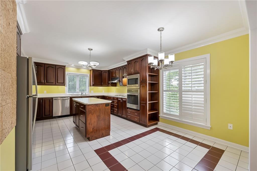1001 Osage Road Pittsburgh, PA 15243 - Photo 12 of 42 a kitchen with stainless steel appliances granite countertop a stove and a refrigerator