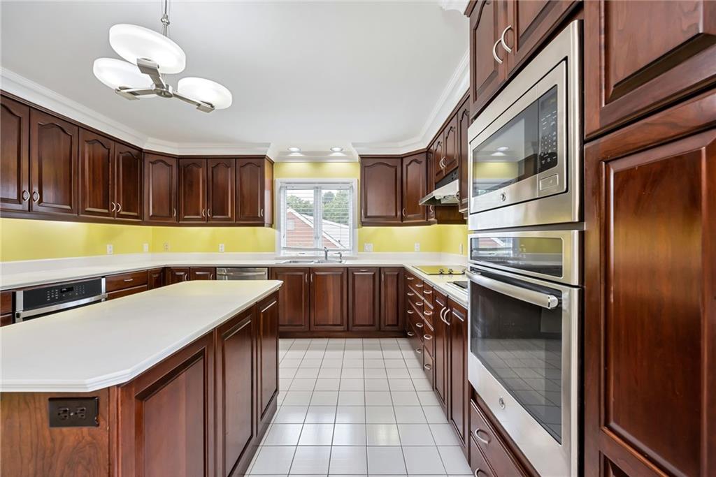 1001 Osage Road Pittsburgh, PA 15243 - Photo 13 of 42 a kitchen with stainless steel appliances granite countertop a sink and cabinets