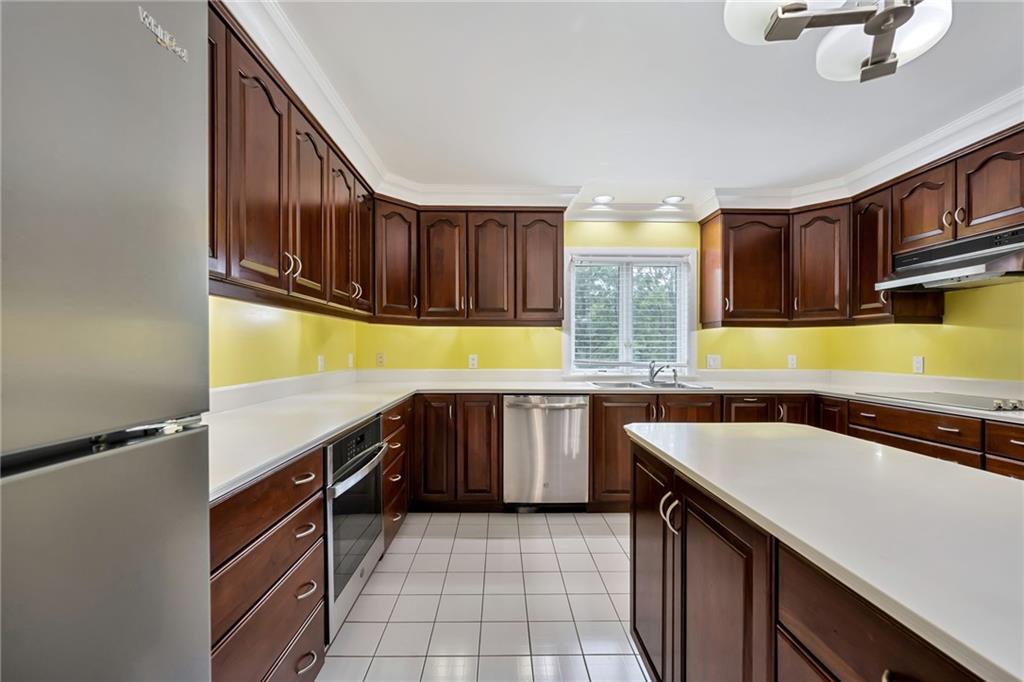 1001 Osage Road Pittsburgh, PA 15243 - Photo 14 of 42 a kitchen with stainless steel appliances a sink and cabinets
