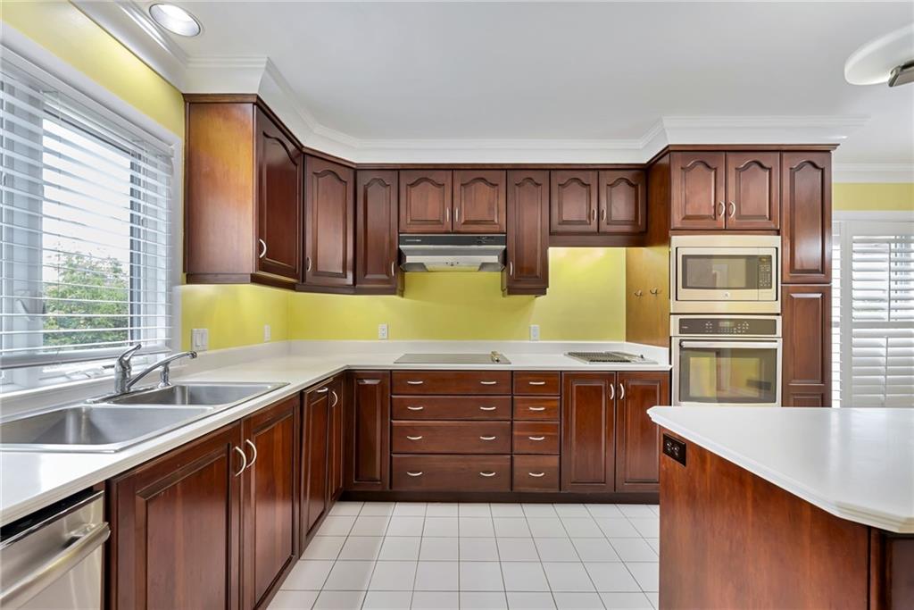 1001 Osage Road Pittsburgh, PA 15243 - Photo 15 of 42 a kitchen with a sink stove and cabinets