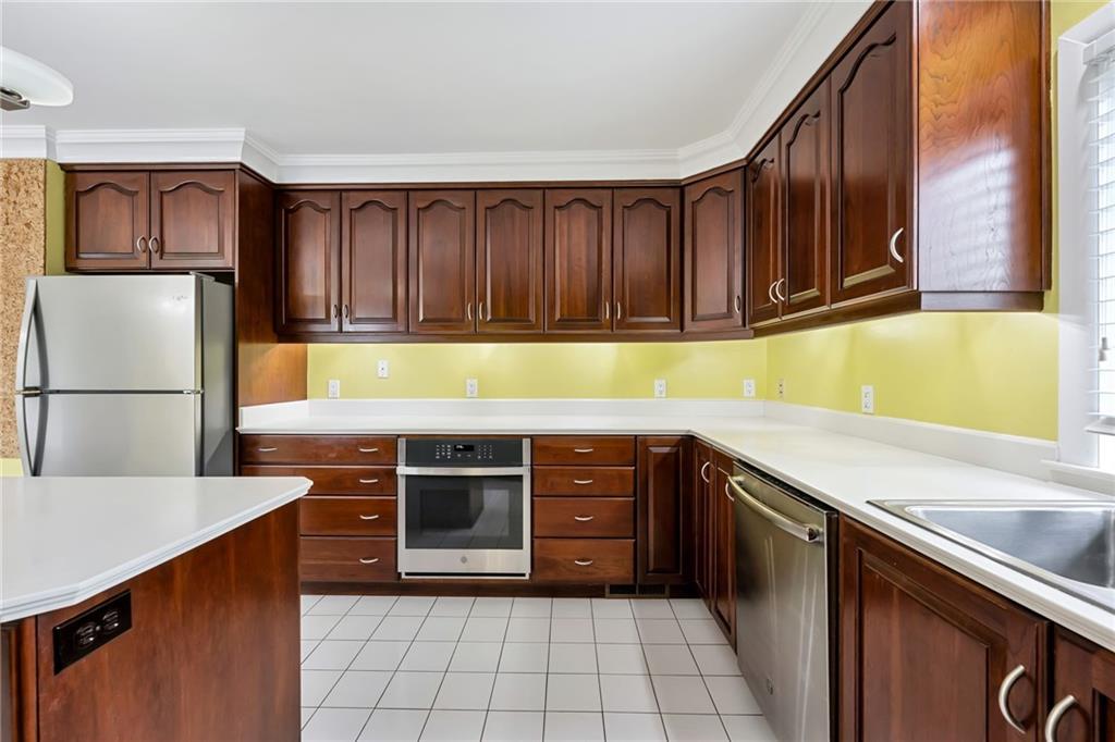 1001 Osage Road Pittsburgh, PA 15243 - Photo 18 of 42 a kitchen with stainless steel appliances granite countertop a refrigerator and a sink