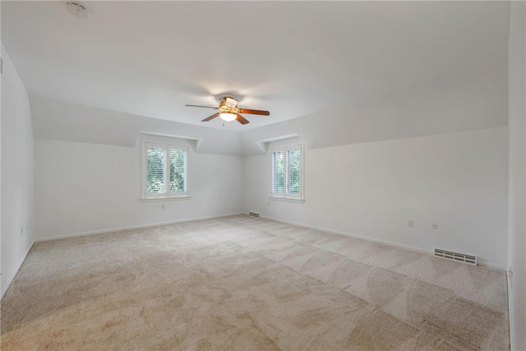 1001 Osage Road Pittsburgh, PA 15243 - Photo 22 of 42 an empty room with a window and ceiling fan