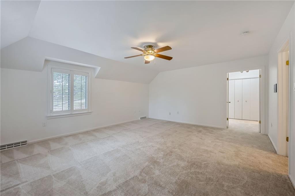 1001 Osage Road Pittsburgh, PA 15243 - Photo 23 of 42 an empty room with a window and a ceiling fan