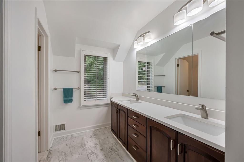 1001 Osage Road Pittsburgh, PA 15243 - Photo 33 of 42 a bathroom with double sink and a mirror