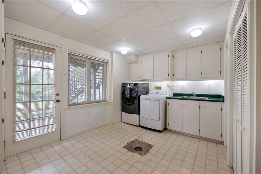 1001 Osage Road Pittsburgh, PA 15243 - Photo 37 of 42 a utility room with cabinets washer and dryer