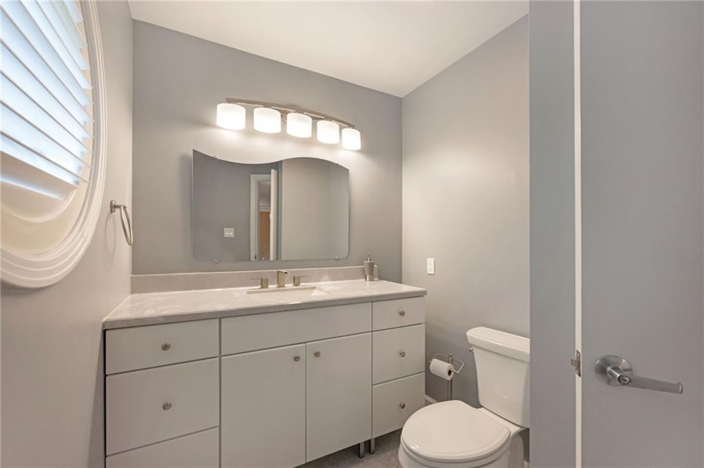 1001 Osage Road Pittsburgh, PA 15243 - Photo 4 of 42 a bathroom with a toilet sink and mirror