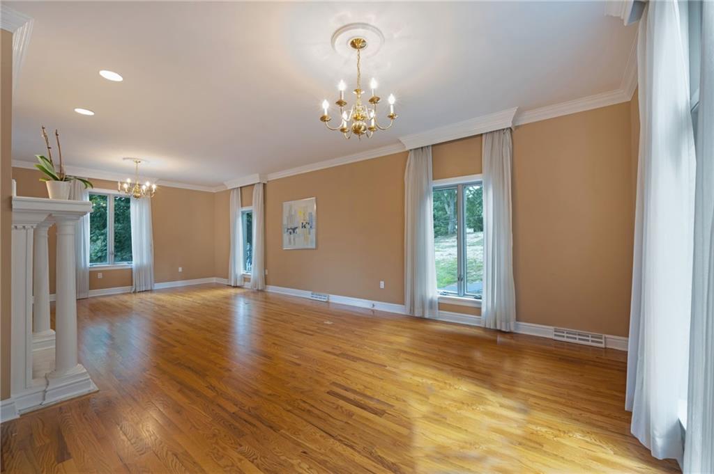 1001 Osage Road Pittsburgh, PA 15243 - Photo 5 of 42 a view of an empty room with window and wooden floor