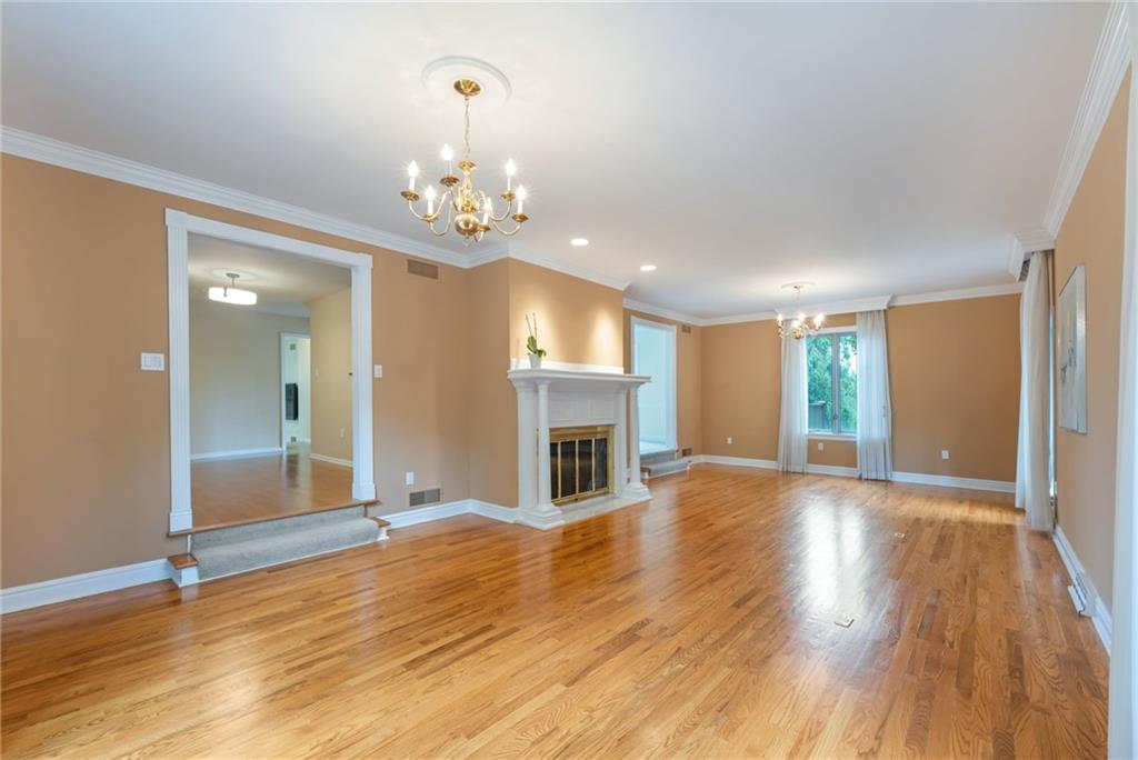 1001 Osage Road Pittsburgh, PA 15243 - Photo 6 of 42 a view of a livingroom with wooden floor and fireplace