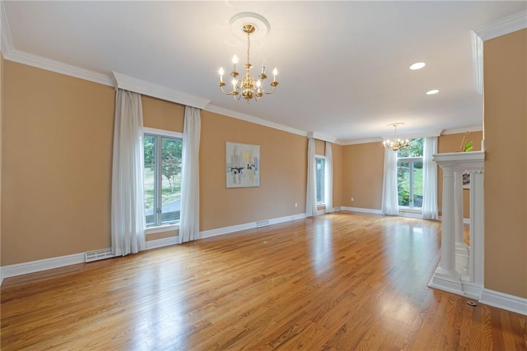1001 Osage Road Pittsburgh, PA 15243 - Photo 8 of 42 a view of an empty room with wooden floor and a window