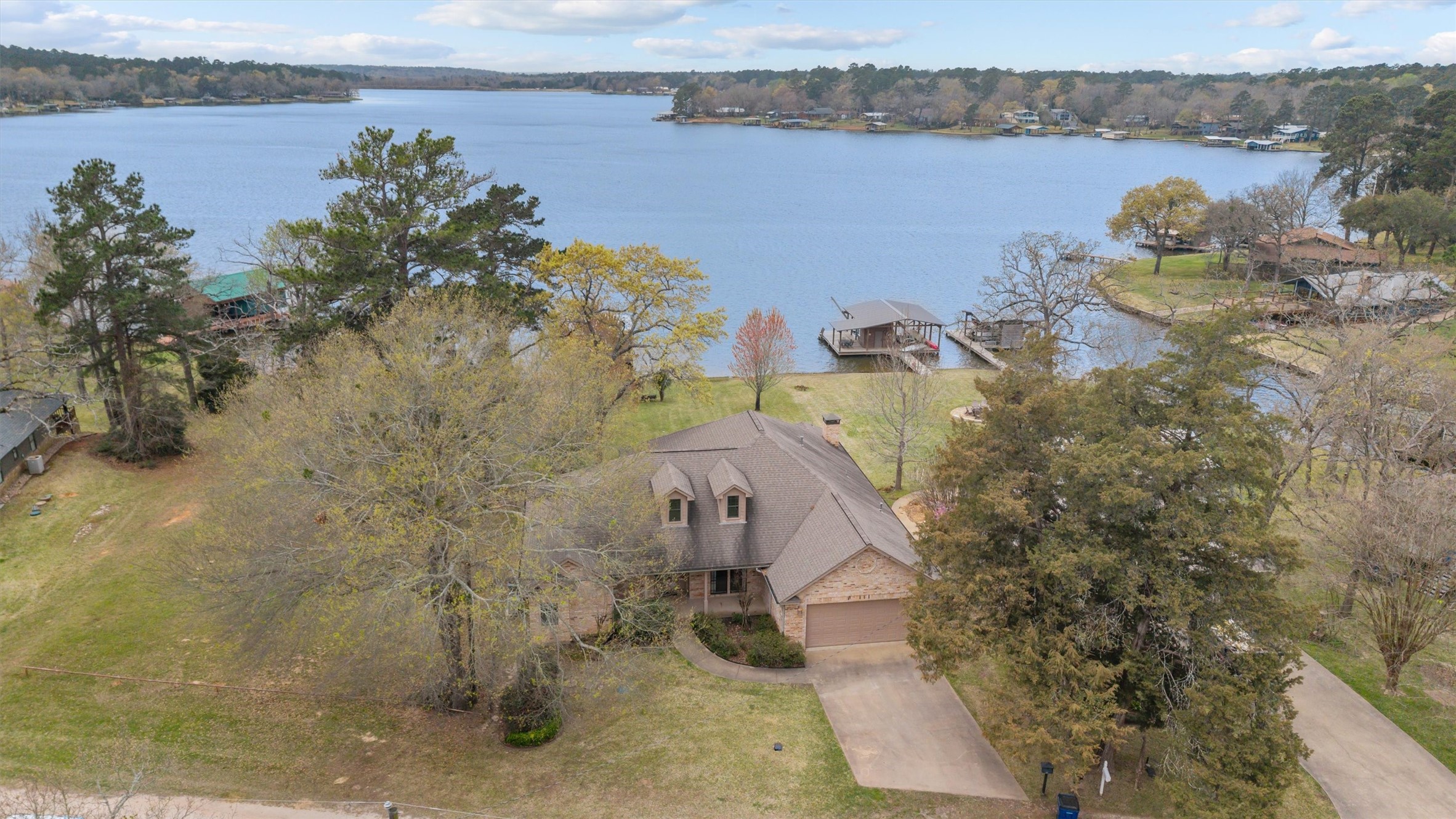 341 Lakeview Drive Grapeland, TX 75844 - Photo 1 of 31 a view of a lake with a mountain in the background