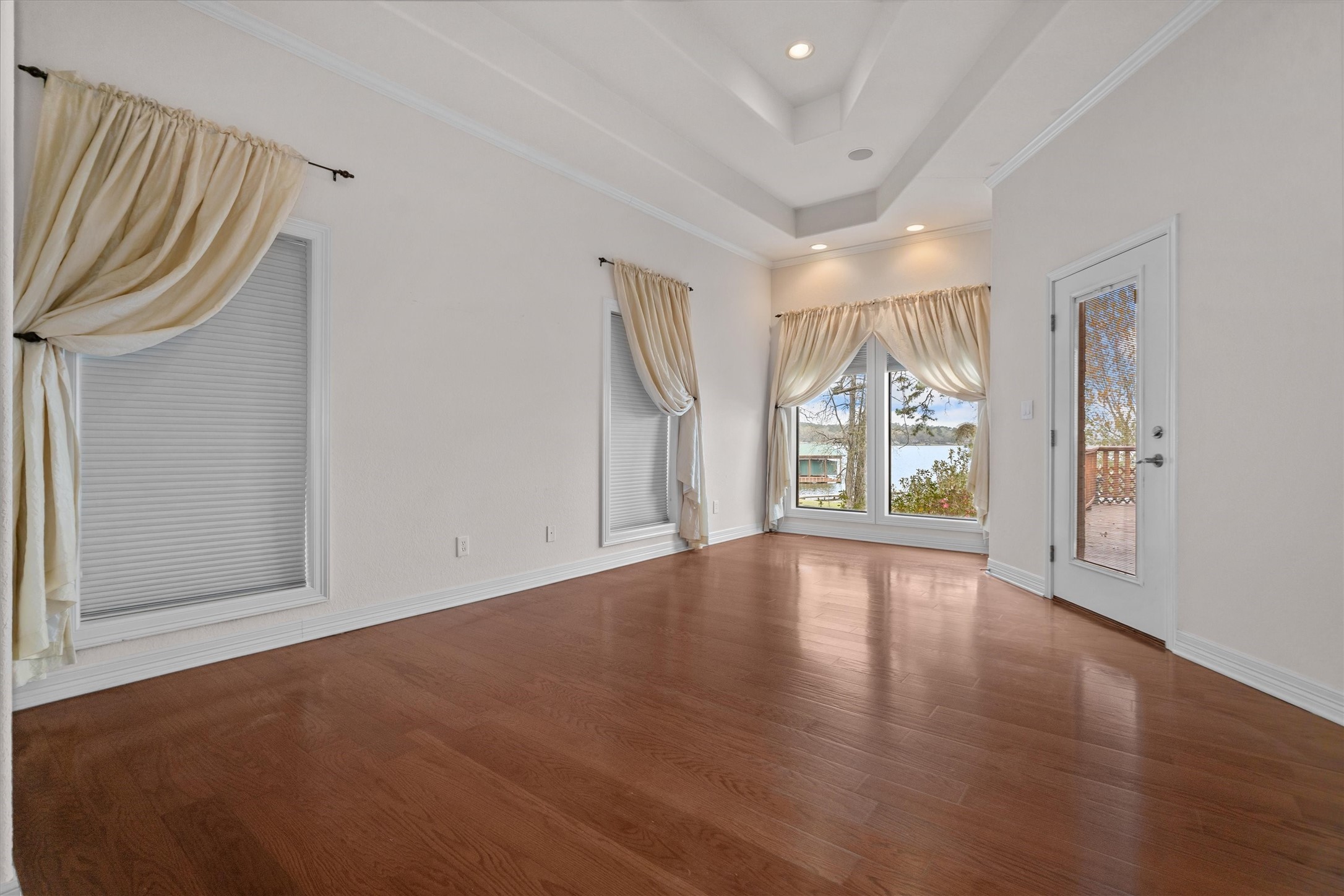 341 Lakeview Drive Grapeland, TX 75844 - Photo 15 of 31 wooden floor in an empty room with a window