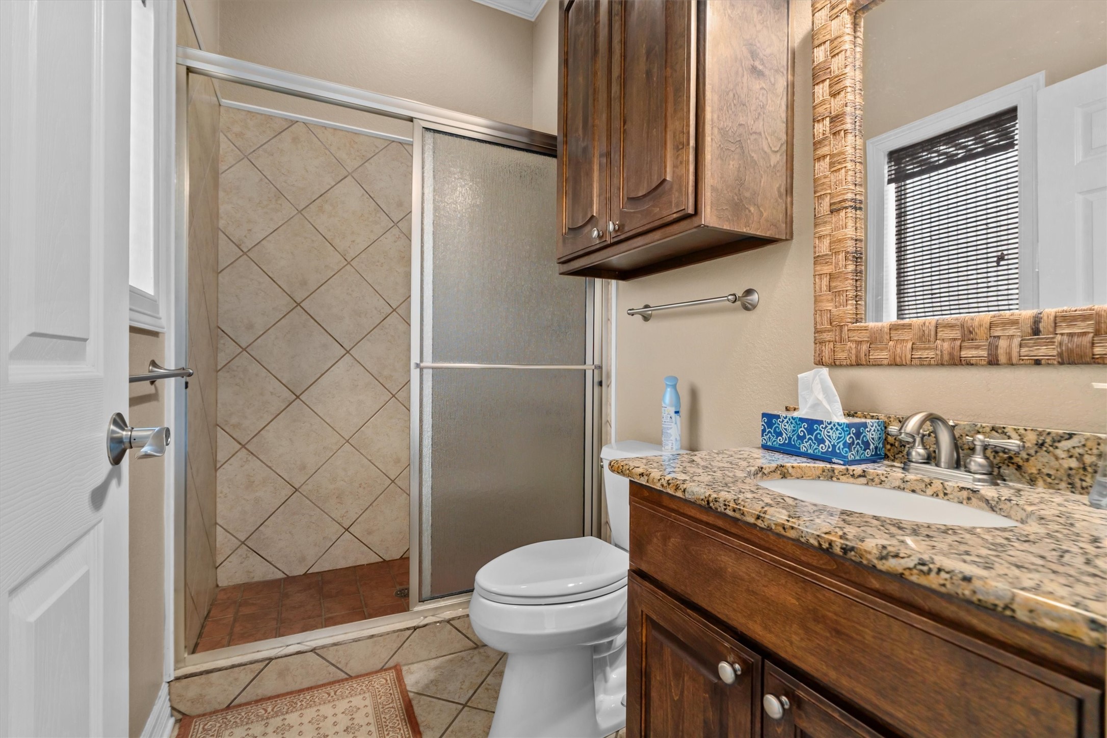 341 Lakeview Drive Grapeland, TX 75844 - Photo 20 of 31 a bathroom with a granite countertop sink toilet and shower