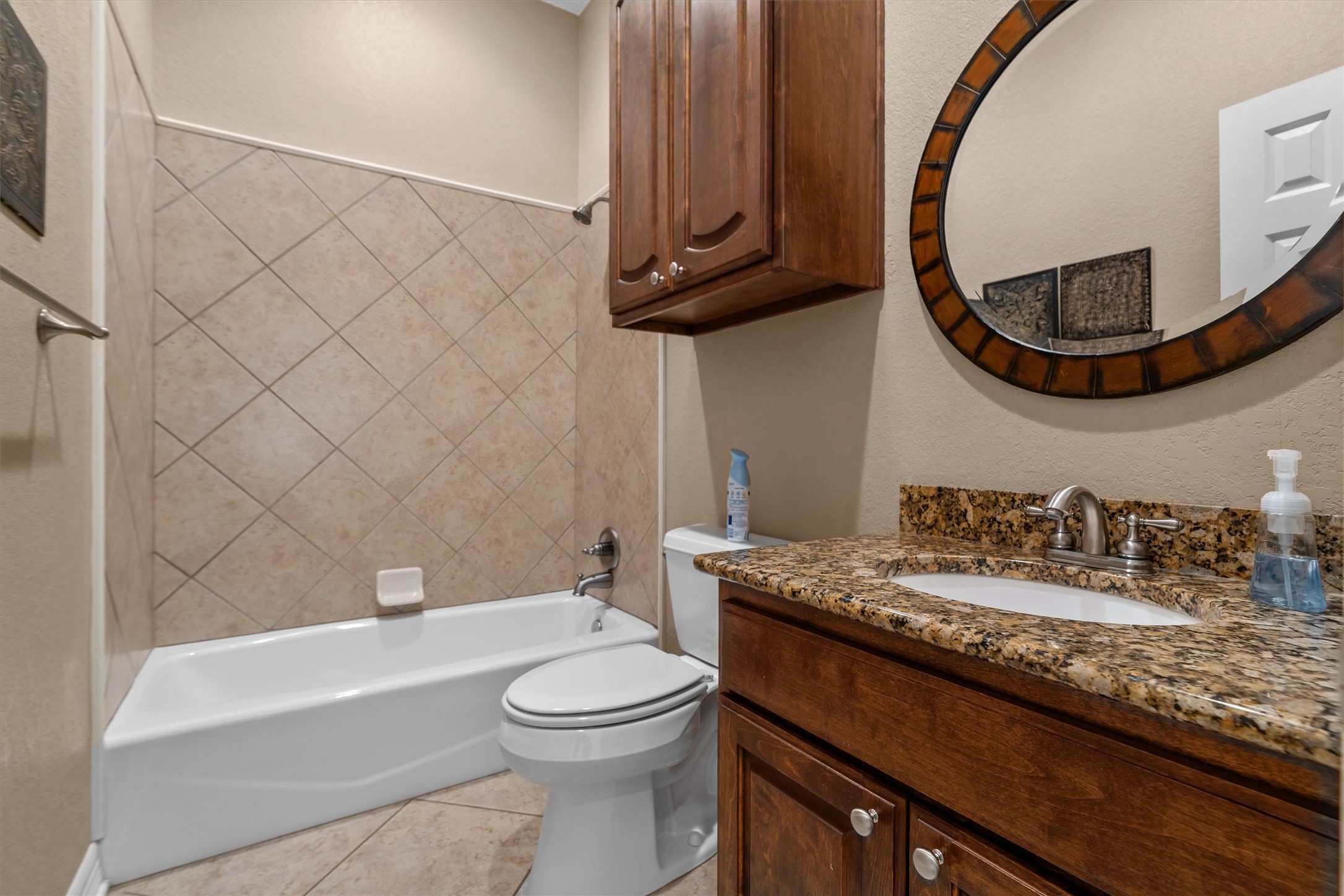341 Lakeview Drive Grapeland, TX 75844 - Photo 22 of 31 a bathroom with a granite countertop bathtub sink vanity mirror and toilet