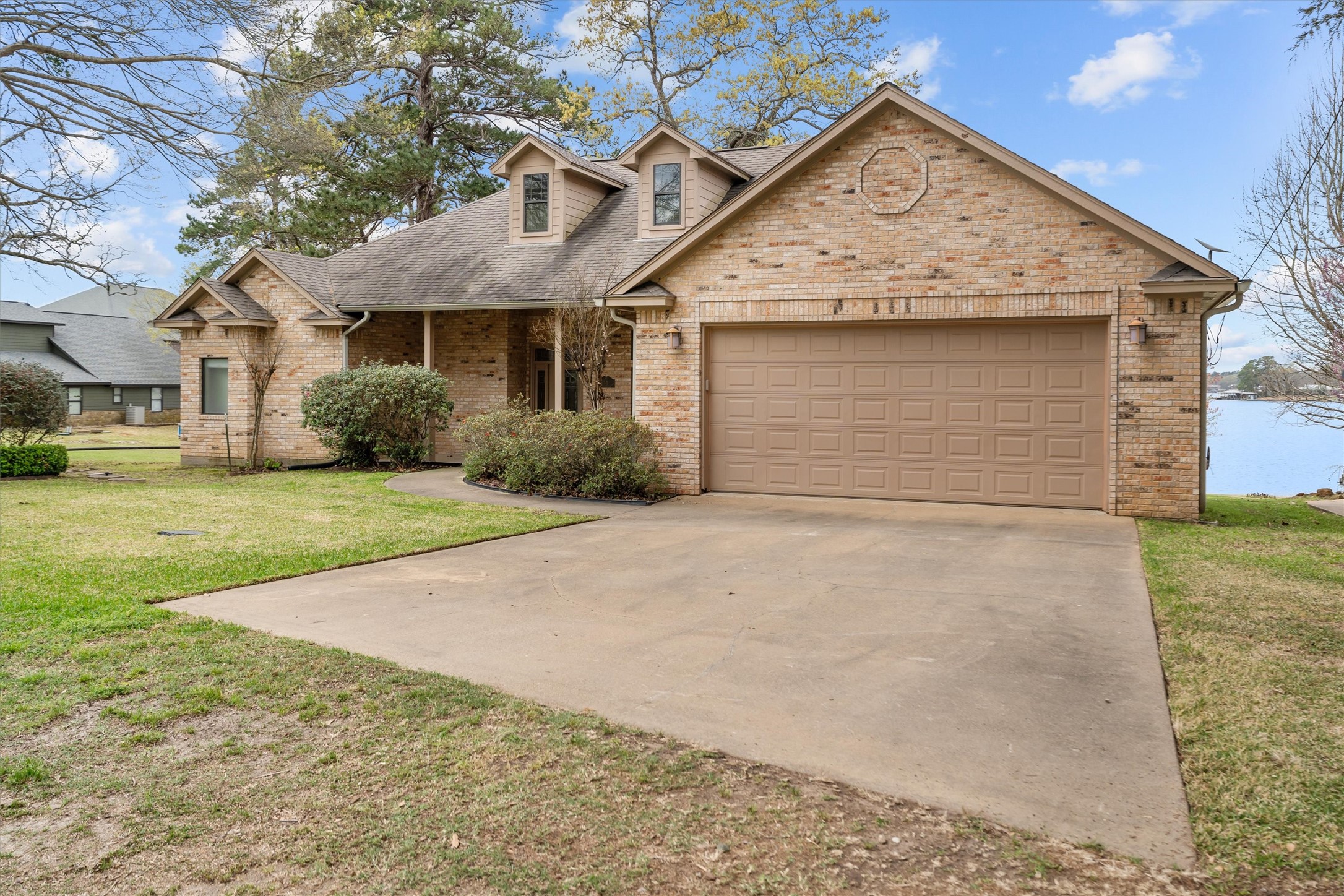 341 Lakeview Drive Grapeland, TX 75844 - Photo 23 of 31 a front view of a house with a yard and garage