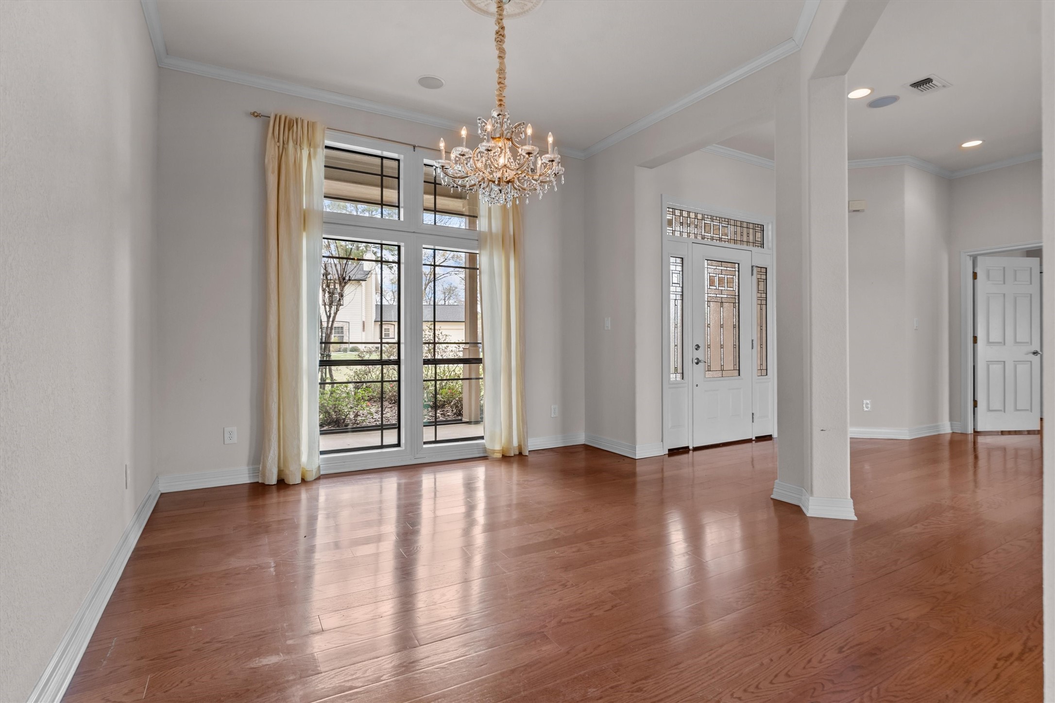 341 Lakeview Drive Grapeland, TX 75844 - Photo 6 of 31 a view of an empty room with wooden floor and a window