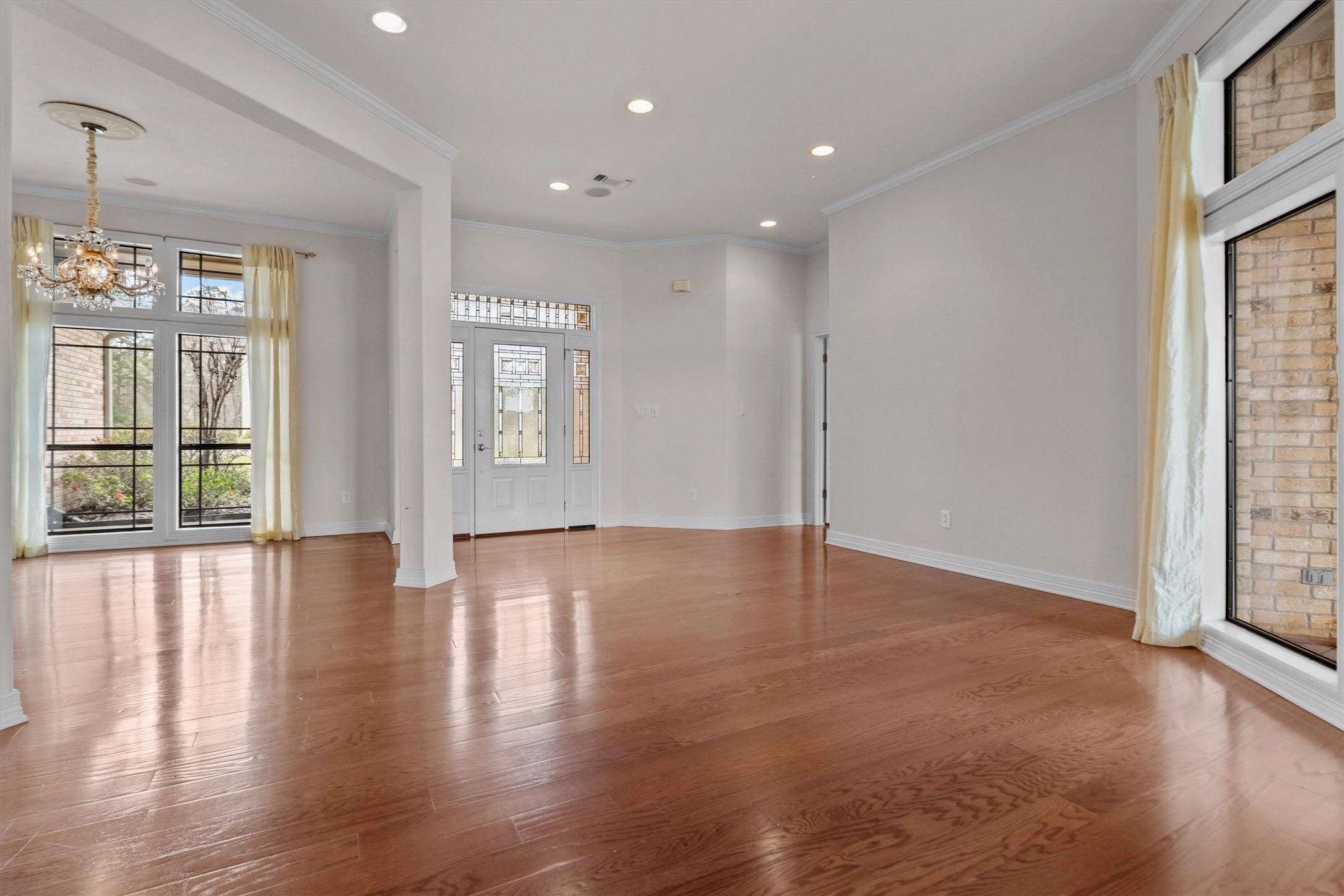 341 Lakeview Drive Grapeland, TX 75844 - Photo 7 of 31 a view of an empty room with wooden floor and a window