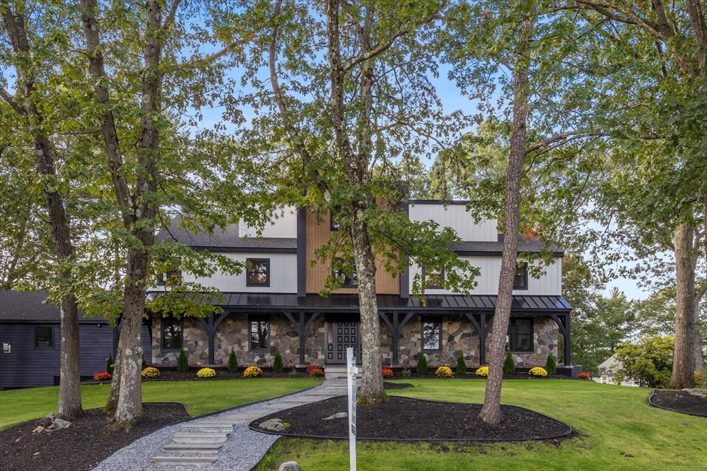 a front view of a house with garden