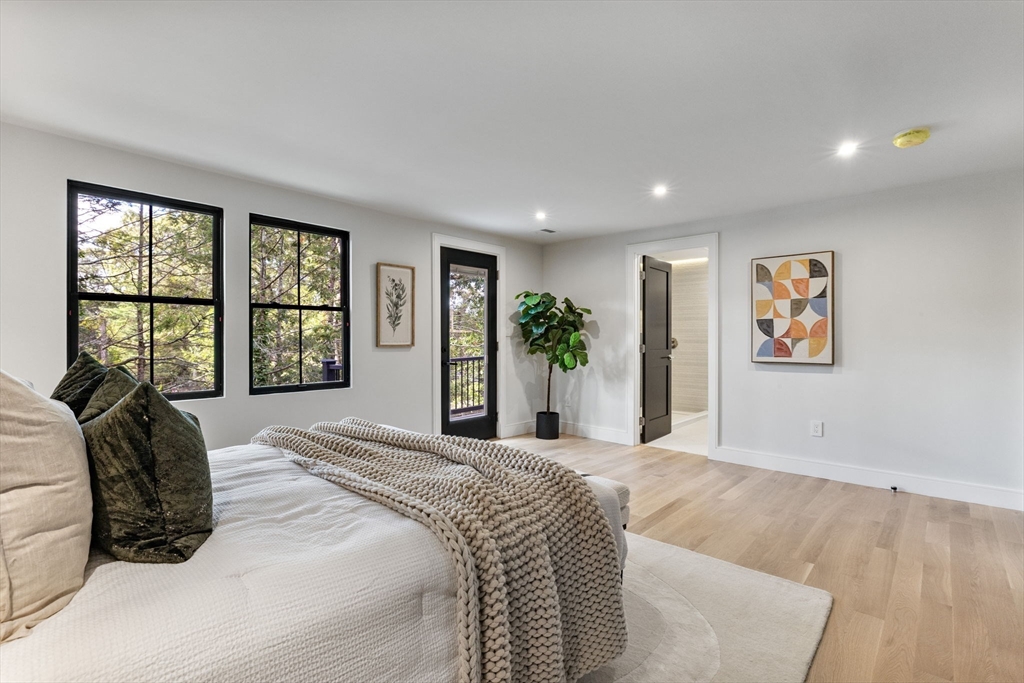 70 Birch Hill Road Belmont, MA 02478 - Photo 22 of 38 a spacious bedroom with a large bed and a large window