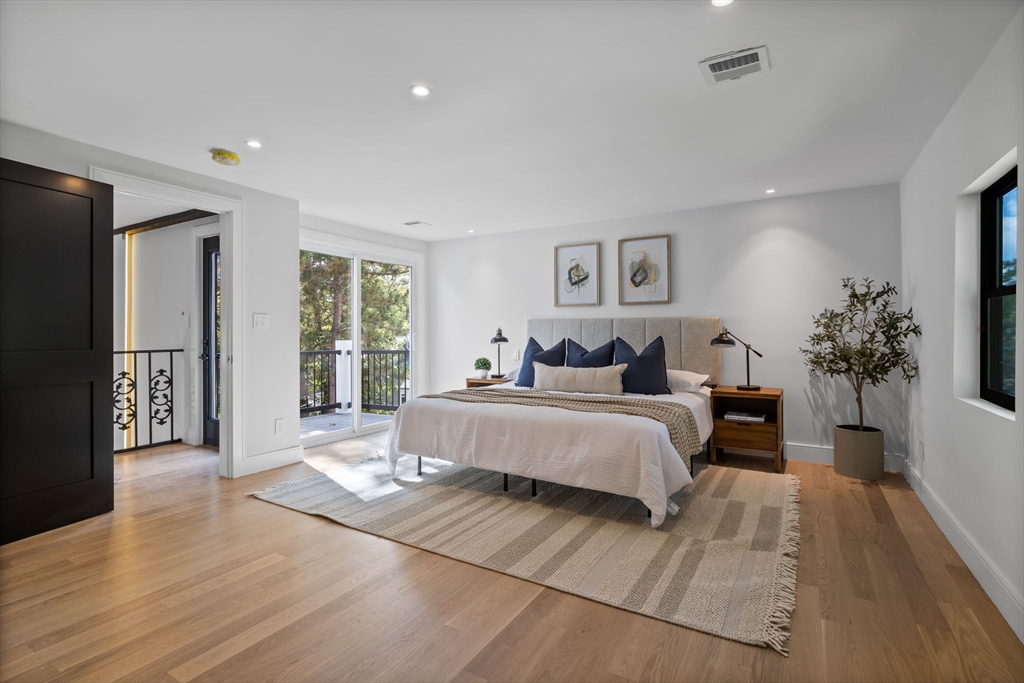 70 Birch Hill Road Belmont, MA 02478 - Photo 29 of 38 a spacious bedroom with a large bed and a potted plant