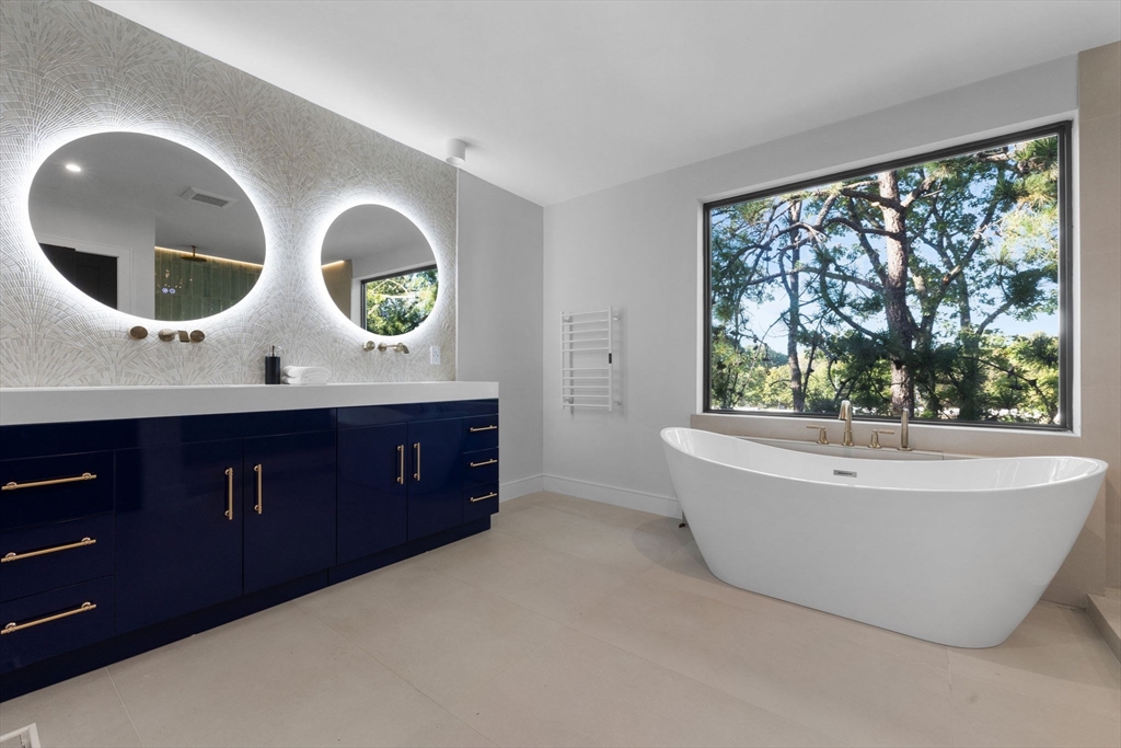 70 Birch Hill Road Belmont, MA 02478 - Photo 32 of 38 a bathroom with a bathtub and mirror