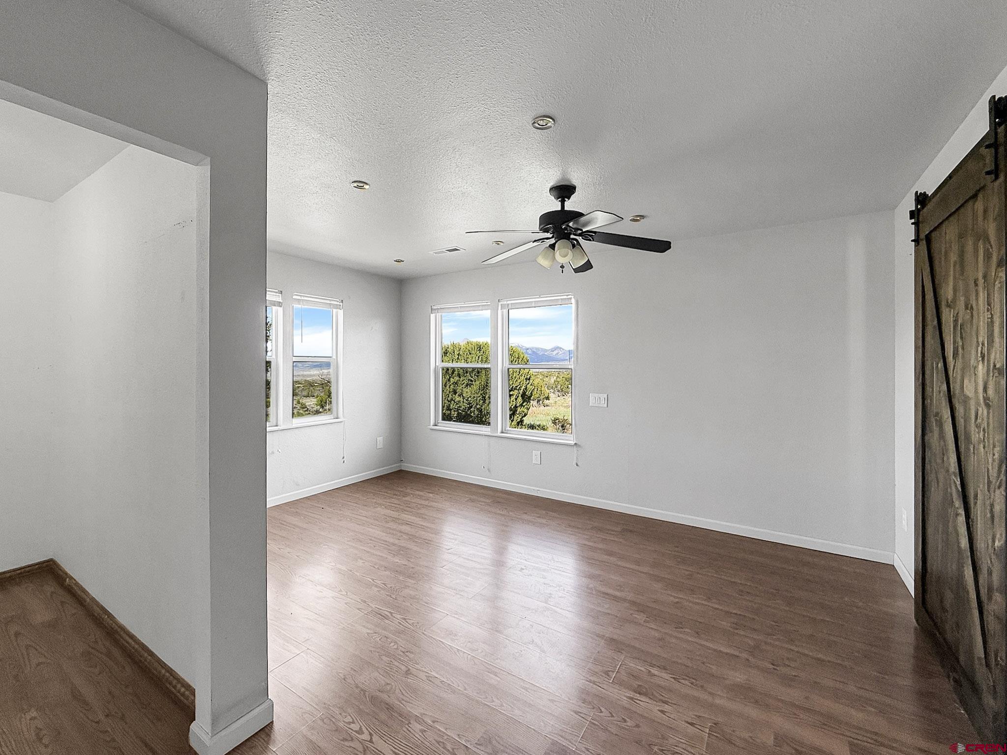 32310 B50 Road Crawford, CO 81415 - Photo 19 of 45 a view of room window and wooden floor