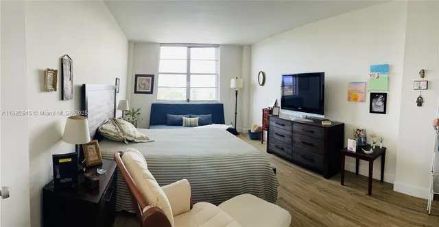 a bedroom with a bed and furniture