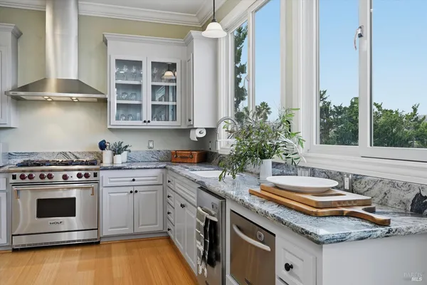 a kitchen with a stove and a sink