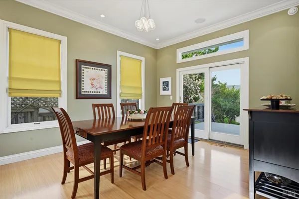 a view of a dining room with furniture window and outside view