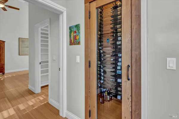 an entryway with a flower pot and a view of bedroom