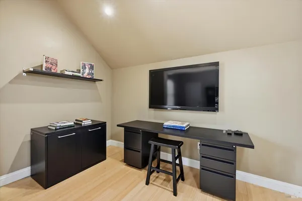 a view of a workspace with furniture