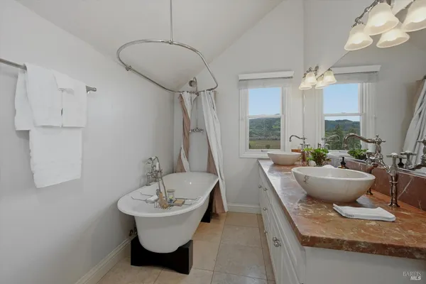 a living room with furniture and a bathtub