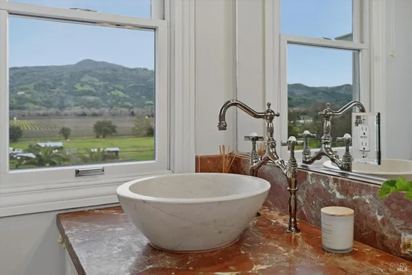a dining room with a table and chairs