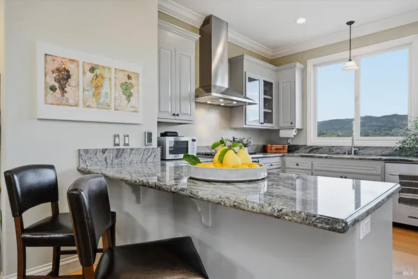 a kitchen with a sink cabinets and window