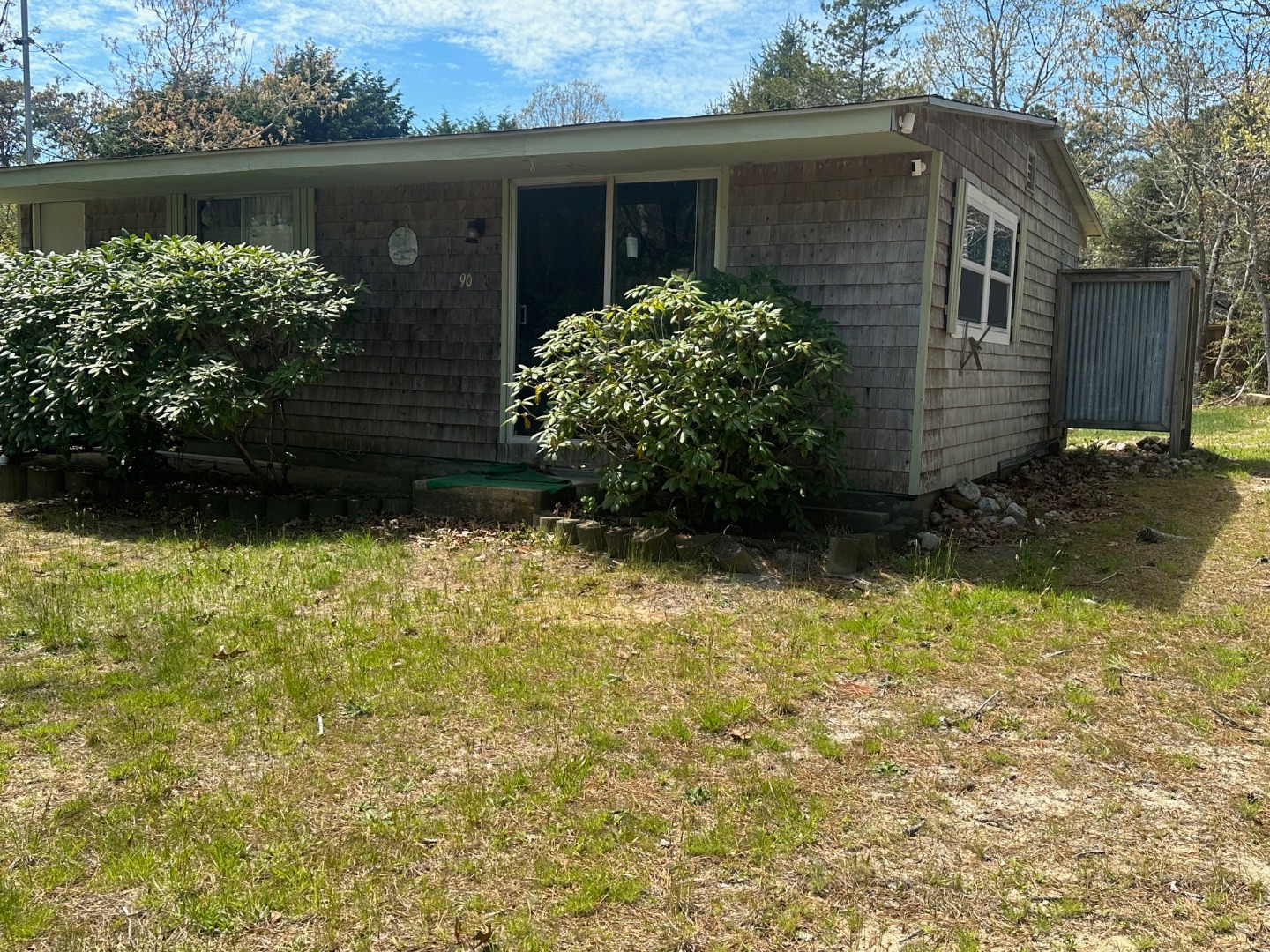 a view of a house with a yard