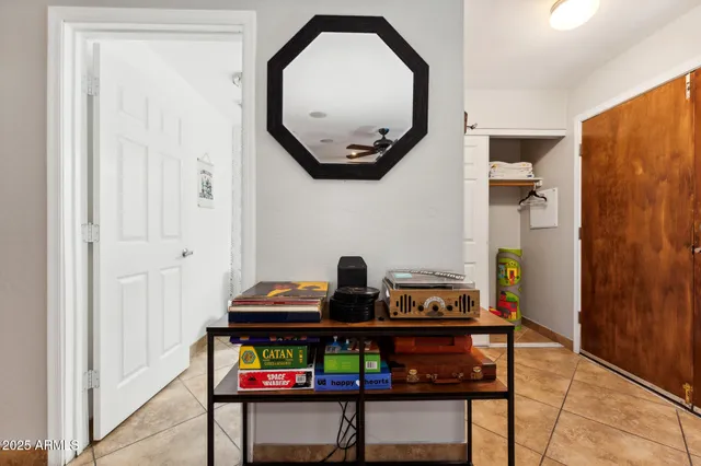 a view of a hallway with wooden floor and furniture