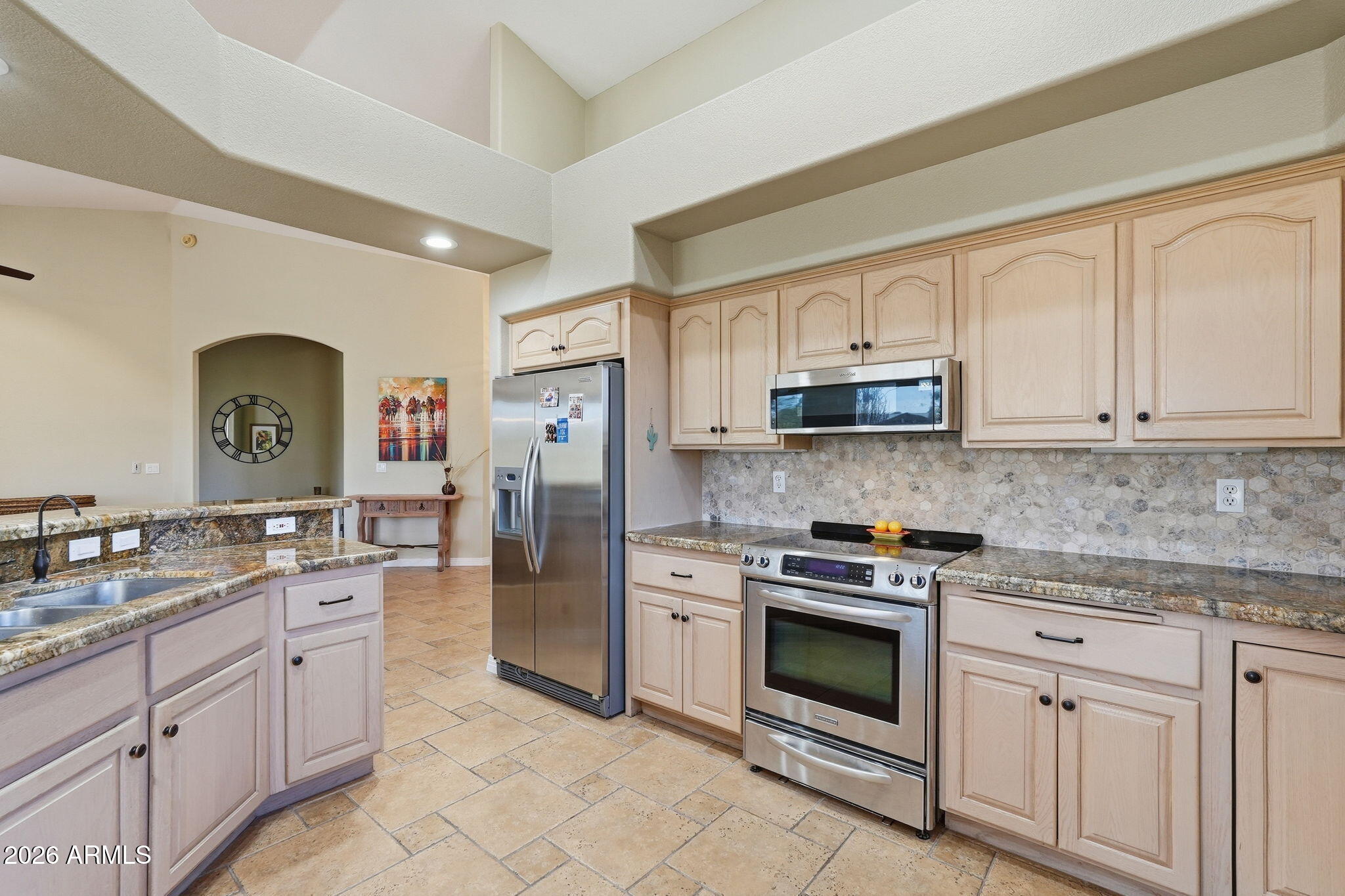 18809 East Avenida Del Ray Rio Verde, AZ 85263 - Photo 12 of 48 a kitchen with stainless steel appliances granite countertop a stove a sink and a refrigerator