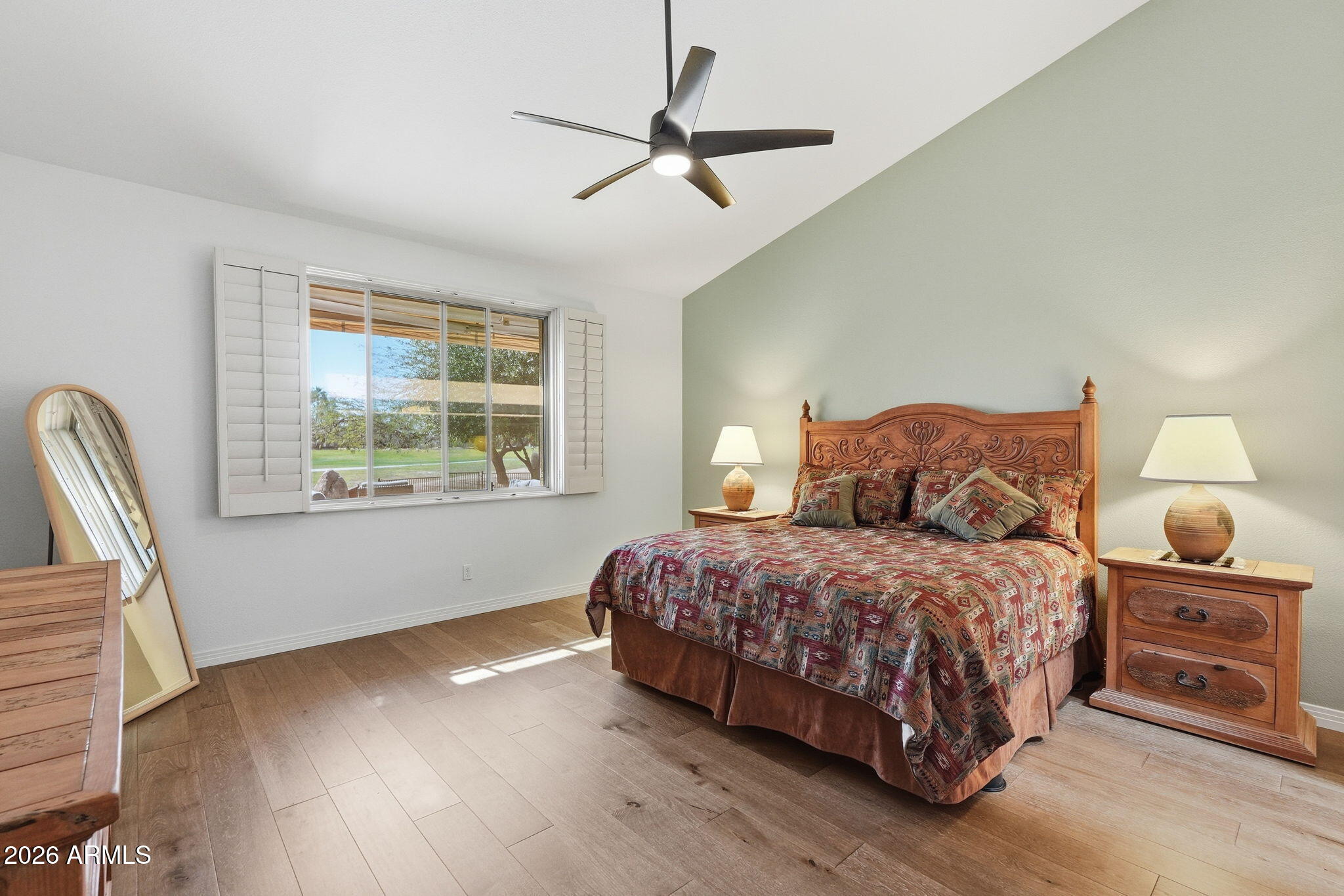 18809 East Avenida Del Ray Rio Verde, AZ 85263 - Photo 14 of 48 a bedroom with a bed a chandelier and a window