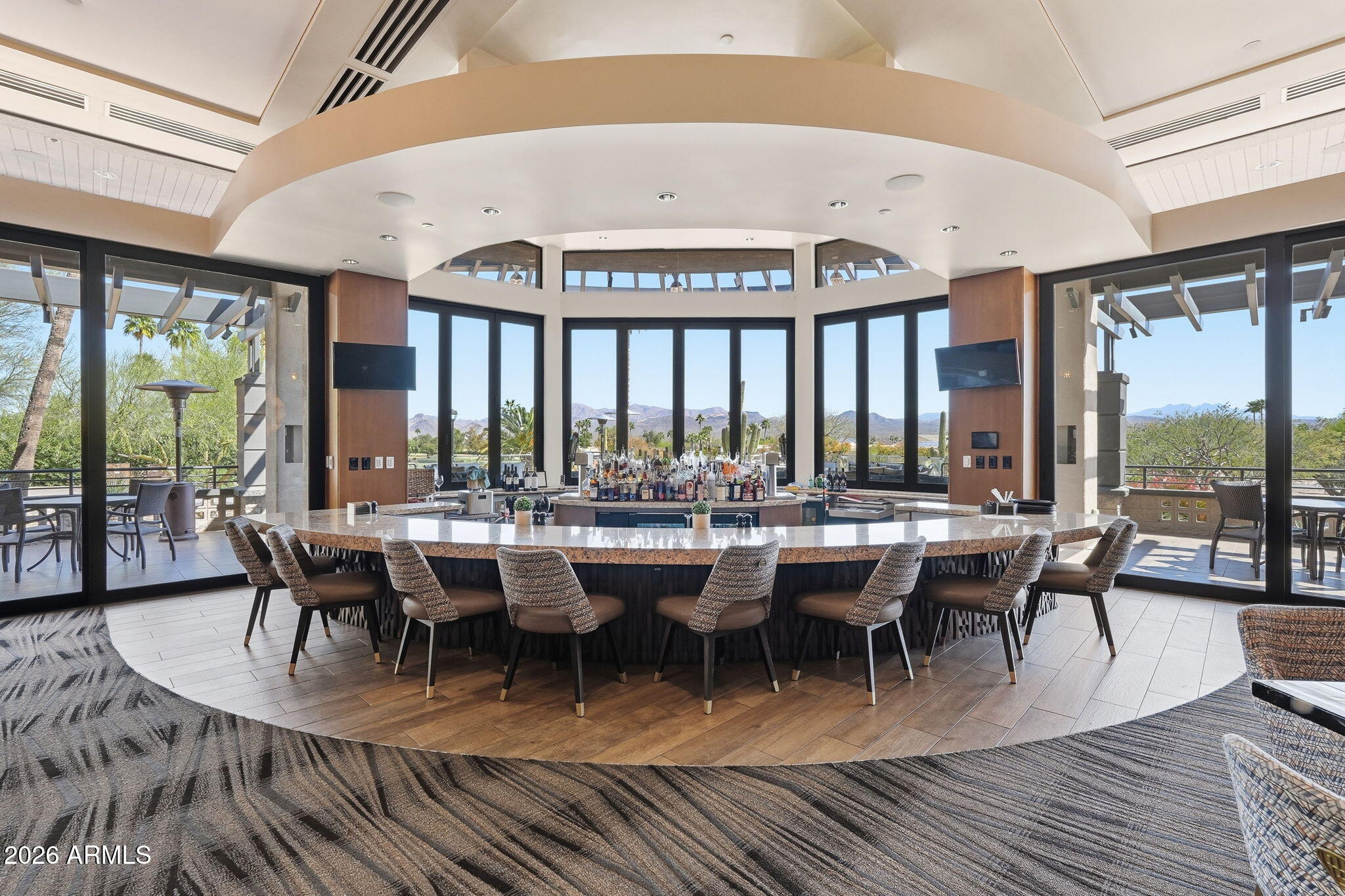 18809 East Avenida Del Ray Rio Verde, AZ 85263 - Photo 37 of 48 a view of a dining room with furniture large windows and wooden floor