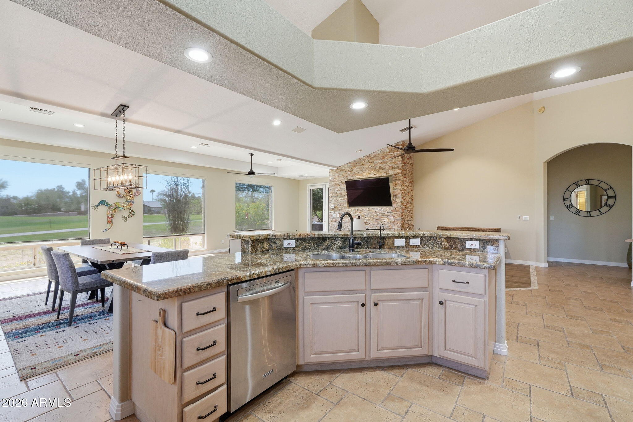 18809 East Avenida Del Ray Rio Verde, AZ 85263 - Photo 7 of 48 a kitchen with a sink stove and wooden cabinets