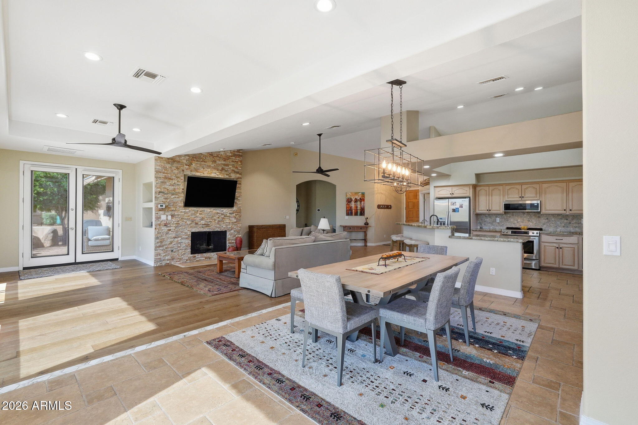 18809 East Avenida Del Ray Rio Verde, AZ 85263 - Photo 9 of 48 a dining room with furniture a chandelier and kitchen view