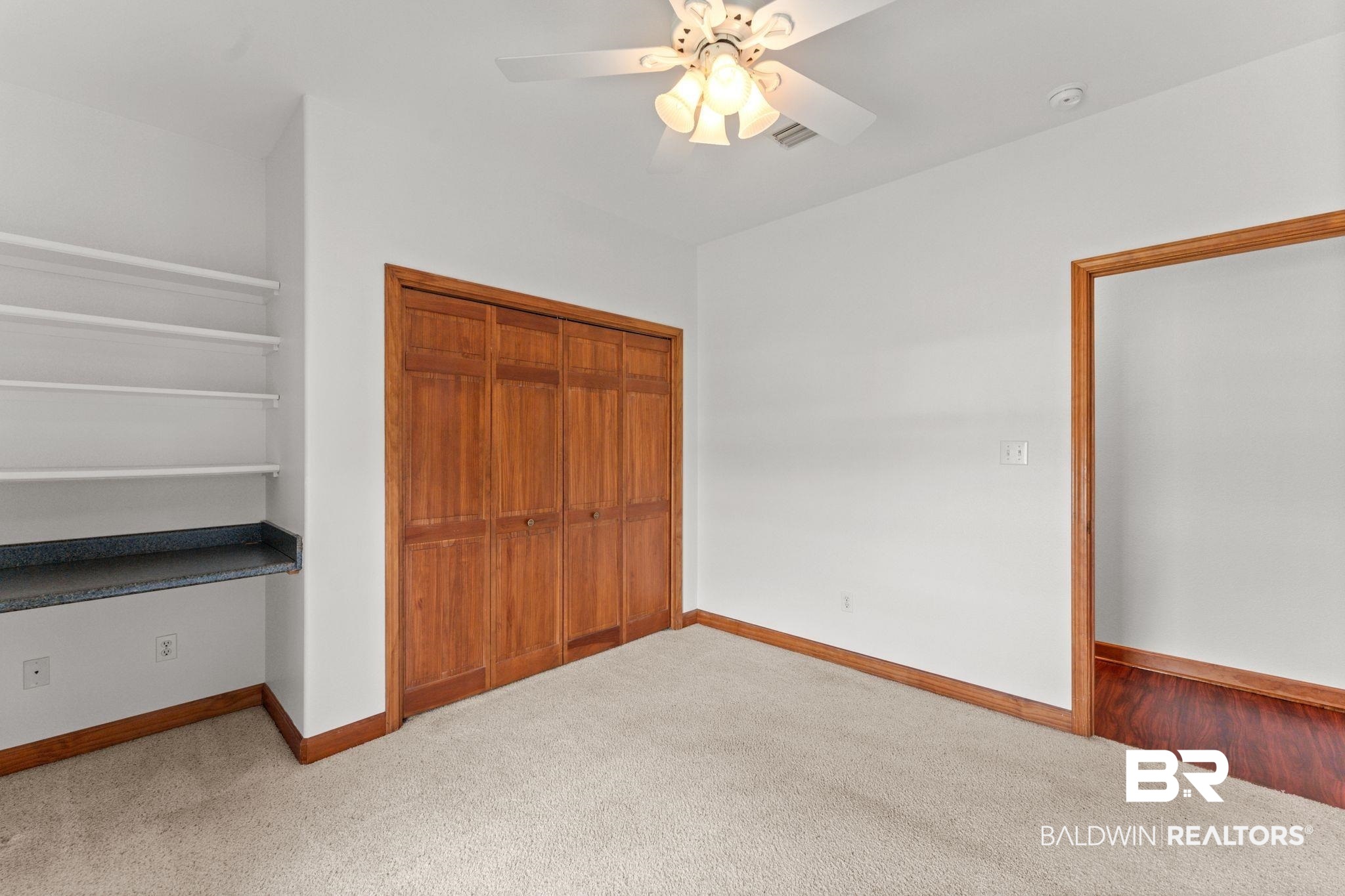 18812 Riverbend Loop Foley, AL 36535 - Photo 28 of 46 Unfurnished bedroom with carpet floors, a closet, and a ceiling fan