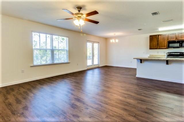 708 Widgeon Way Crestview, FL 32539 - Photo 1 of 18 Elle family room to kitchen
