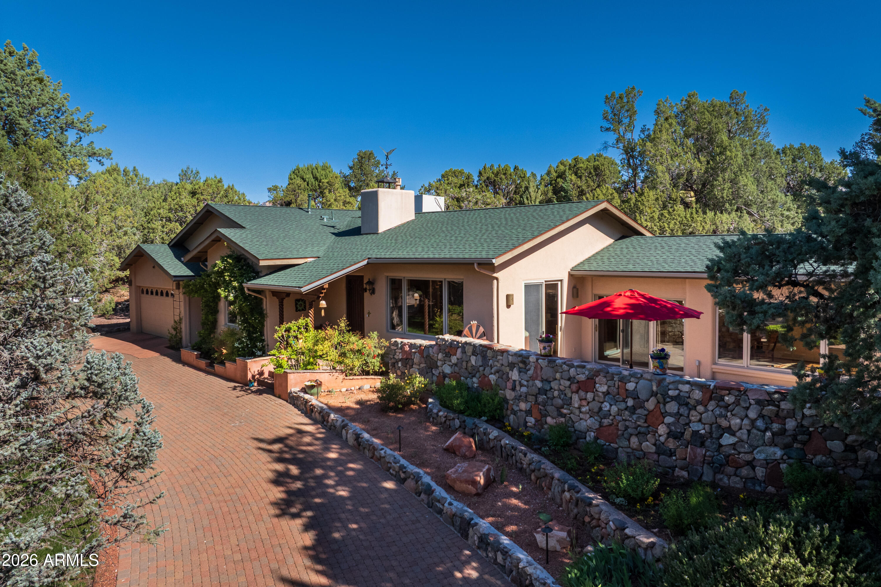 190 Morgan Road Sedona, AZ 86336 - Photo 2 of 51 a front view of a house with a yard