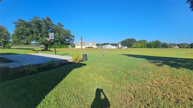 a view of a lake with a big yard