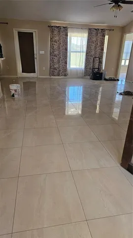 a view of an empty room with a window