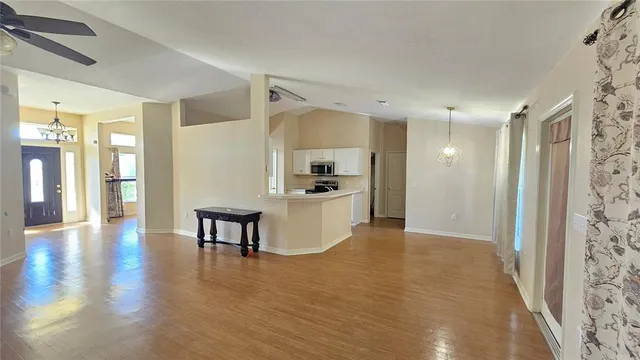 a kitchen with a refrigerator and a sink