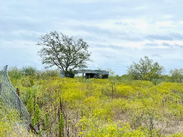 a view of a lake with a big yard