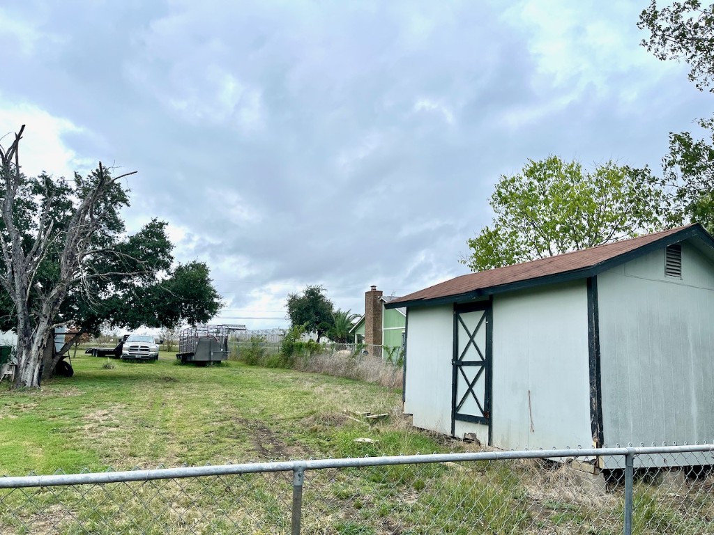 11604 Moore Road Austin, TX 78719 - Photo 11 of 19 a front view of a house with garden